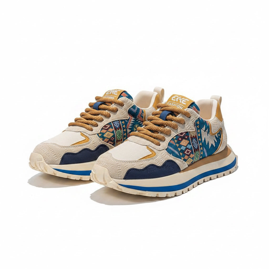 ELKE FASHION men's casual shoes in beige, tan, and blue, highlighting intricate geometric tribal patterns on the sides, tan laces, and a blue-accented chunky midsole.