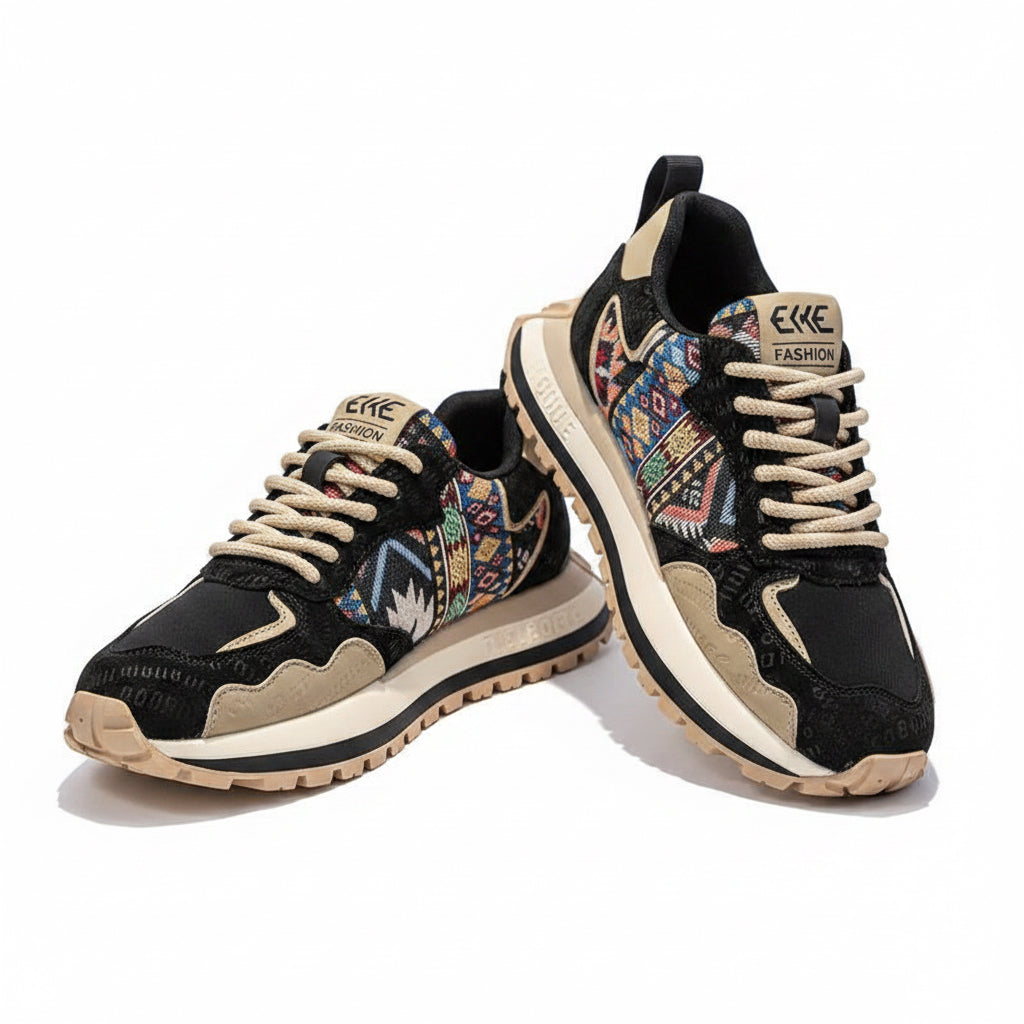 Black and tan ELKE FASHION men's sneakers with colorful geometric woven side panels, cream-colored laces, and a rugged black and white double-layered sole.