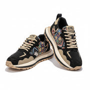 Black and tan ELKE FASHION men's sneakers with colorful geometric woven side panels, cream-colored laces, and a rugged black and white double-layered sole.