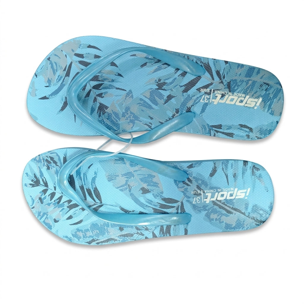 A pair of light blue flip-flops with a tropical leaf pattern, featuring the brand name 'Tropical Sports' printed on the soles, set against a plain white background.