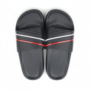 Top view of a pair of men's black slide sandals featuring red and white stripe accents on the upper strap.