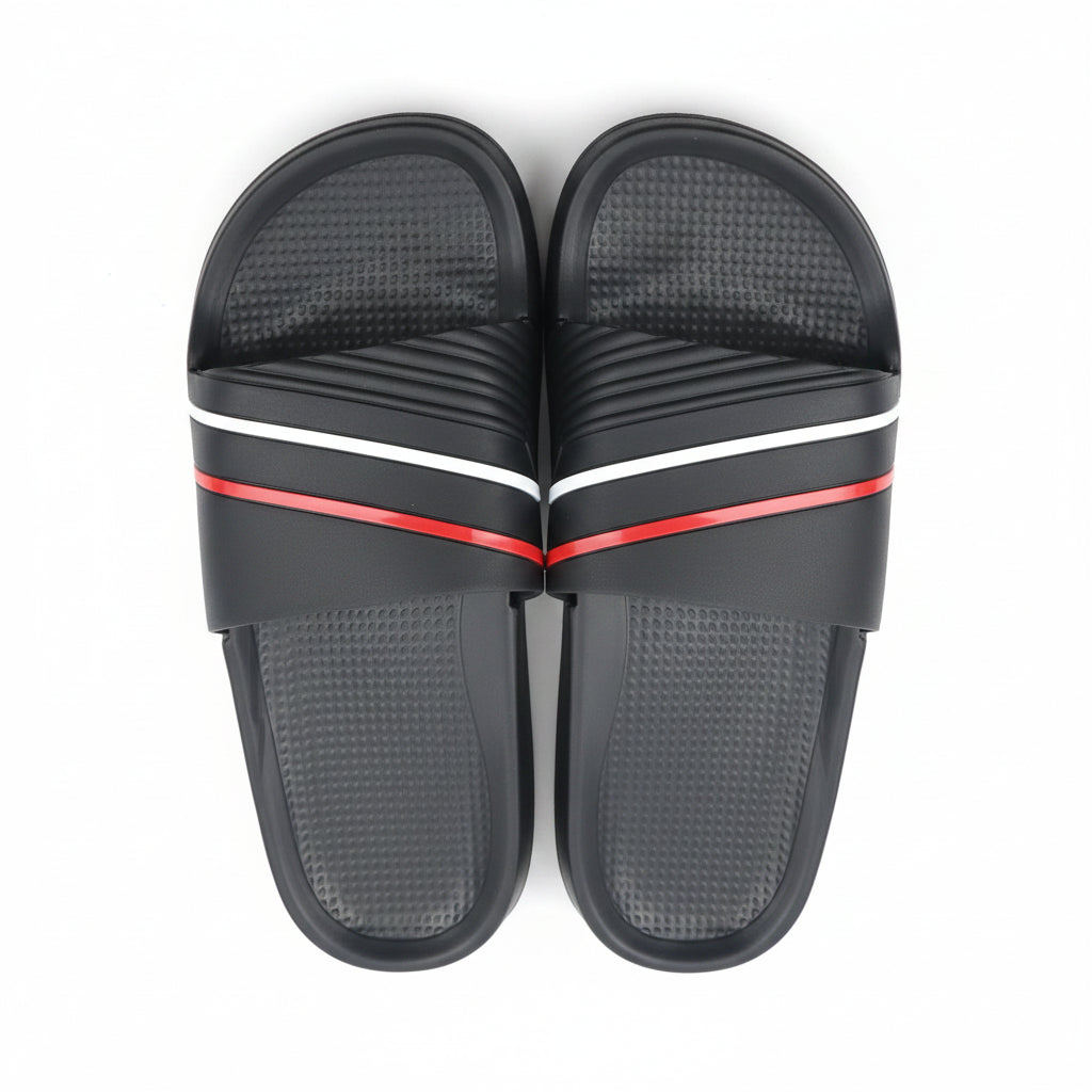 Top view of a pair of men's black slide sandals featuring red and white stripe accents on the upper strap.