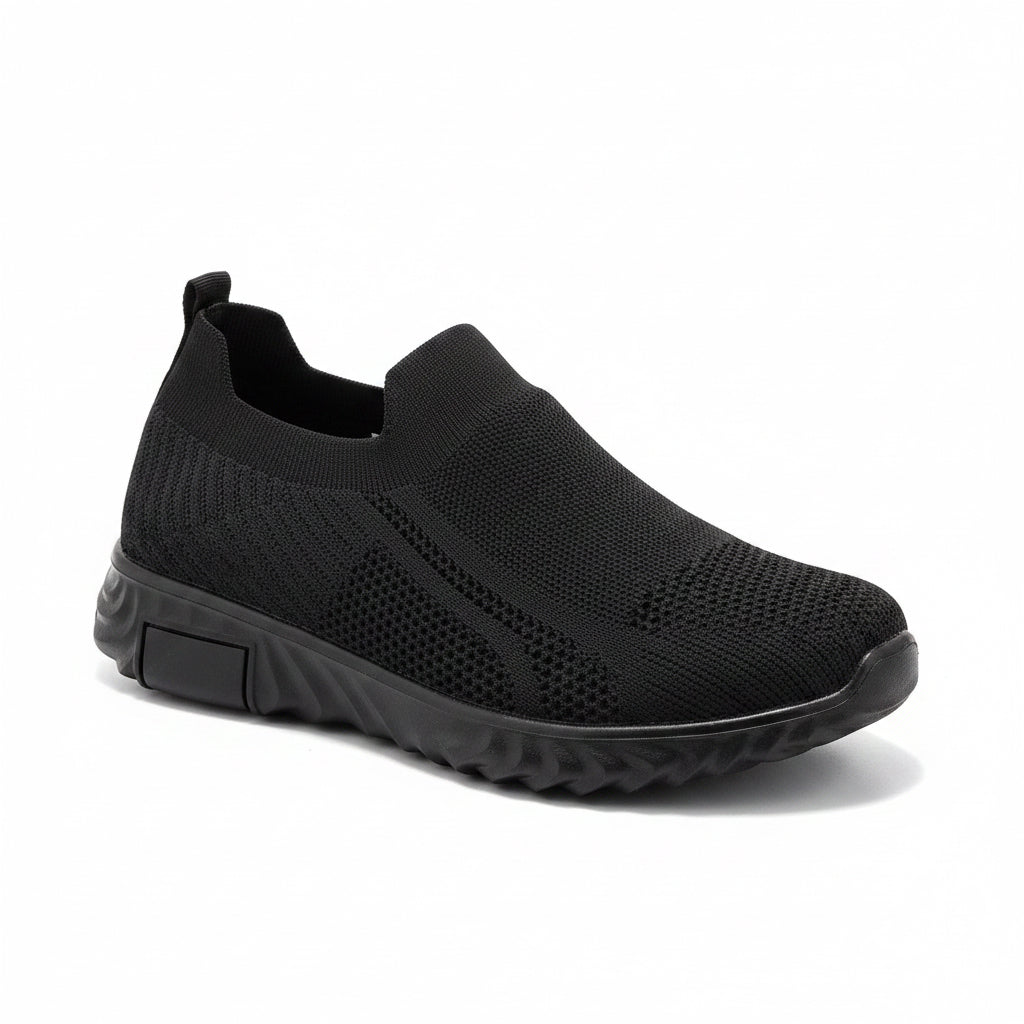 Side view of a men's black mesh slip-on walking shoe.