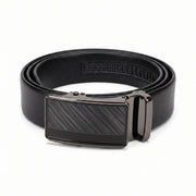 Rolled black men's leather belt with a gunmetal automatic ratchet buckle on a white background