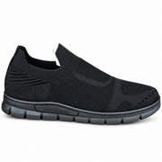 Men's black knit slip-on sneakers featuring a textured upper, laceless design and segmented dark sole – side view