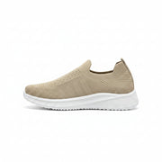 Mens beige slip on walking shoes with breathable knit upper and white cushioned sole