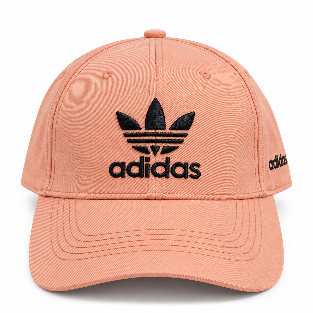 Peach baseball cap with black embroidered logo-style graphic and curved brim