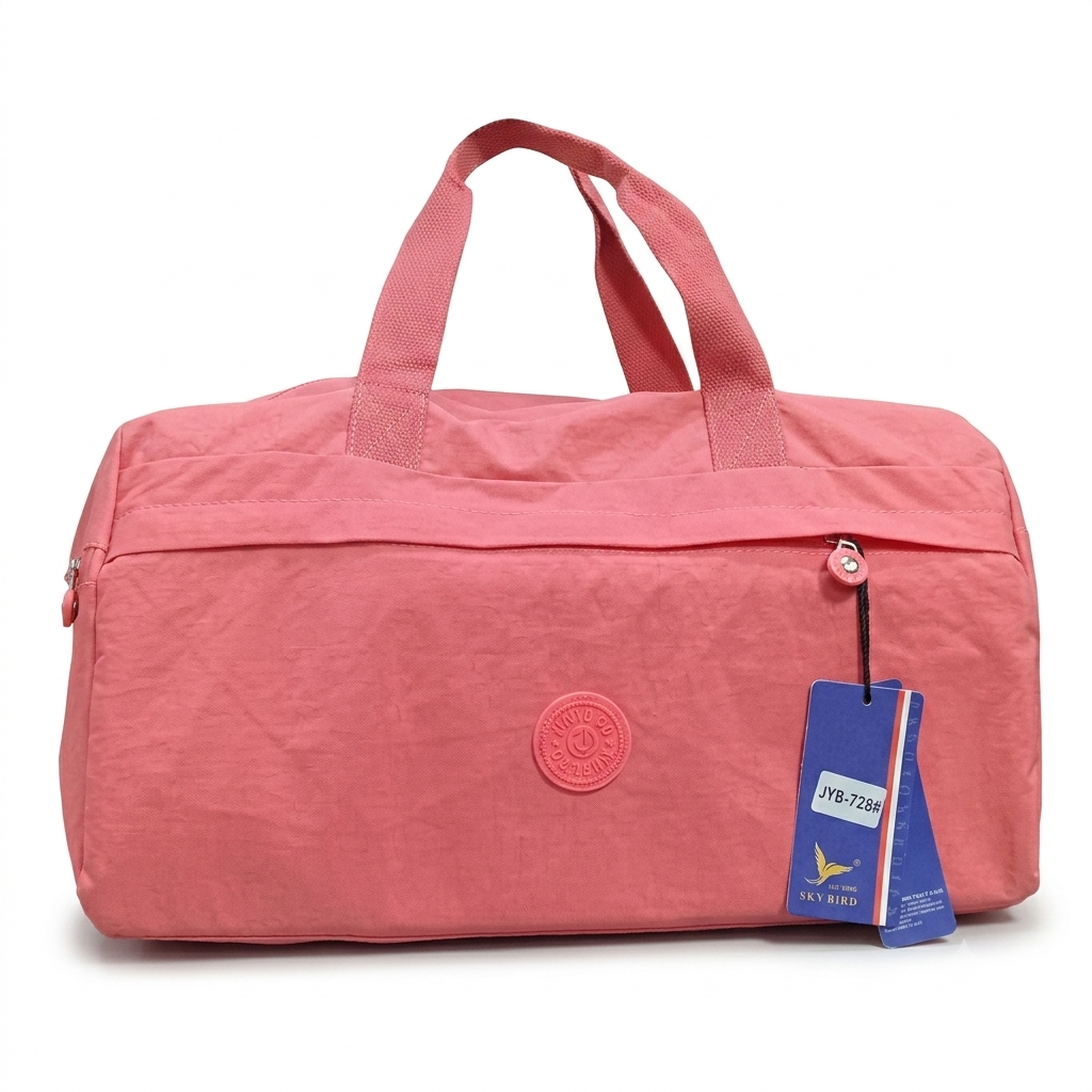A pink nylon duffel bag with dual top handles, a zippered main compartment, a circular embossed logo patch on the front, and a blue hangtag attached near the zipper, photographed on a white background.