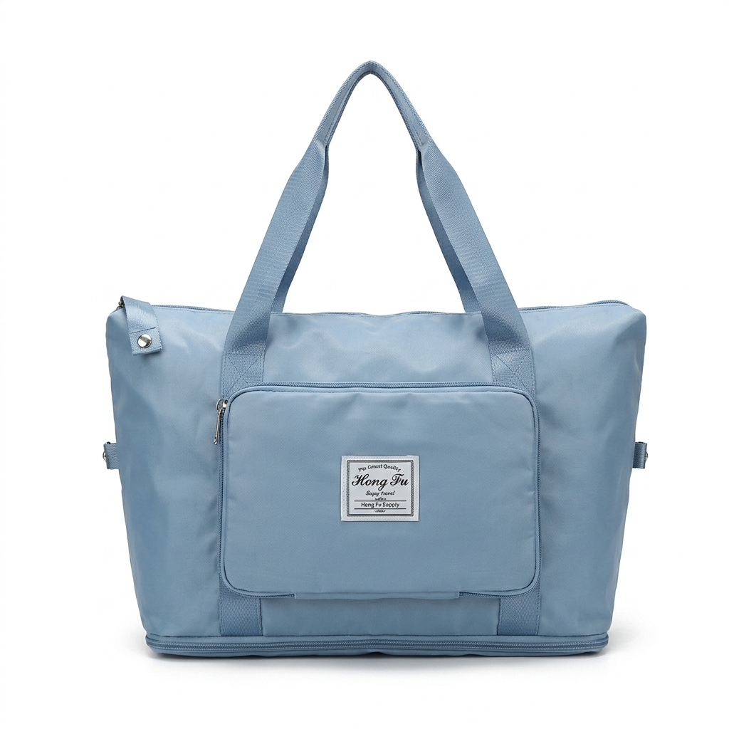 A light blue foldable travel tote bag with dual top handles, a front zippered pocket, and a central white brand label reading 'Hong Fu'.