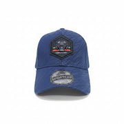 Front view of a blue unisex trucker cap featuring a hexagonal black tiger patch and mesh back
