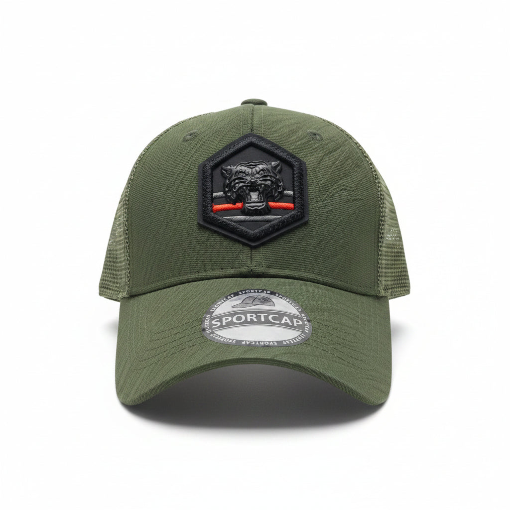 Front view of an olive green unisex trucker cap featuring a hexagonal black tiger patch and mesh back