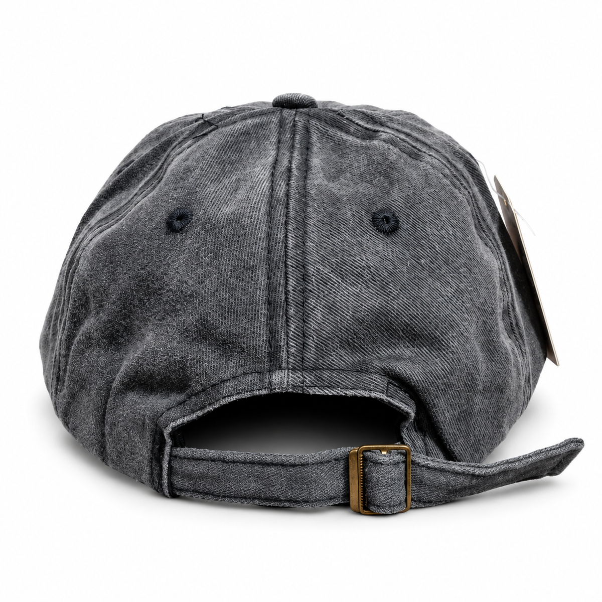 Back view of a vintage black washed baseball cap showing the adjustable cloth strap and metal buckle.