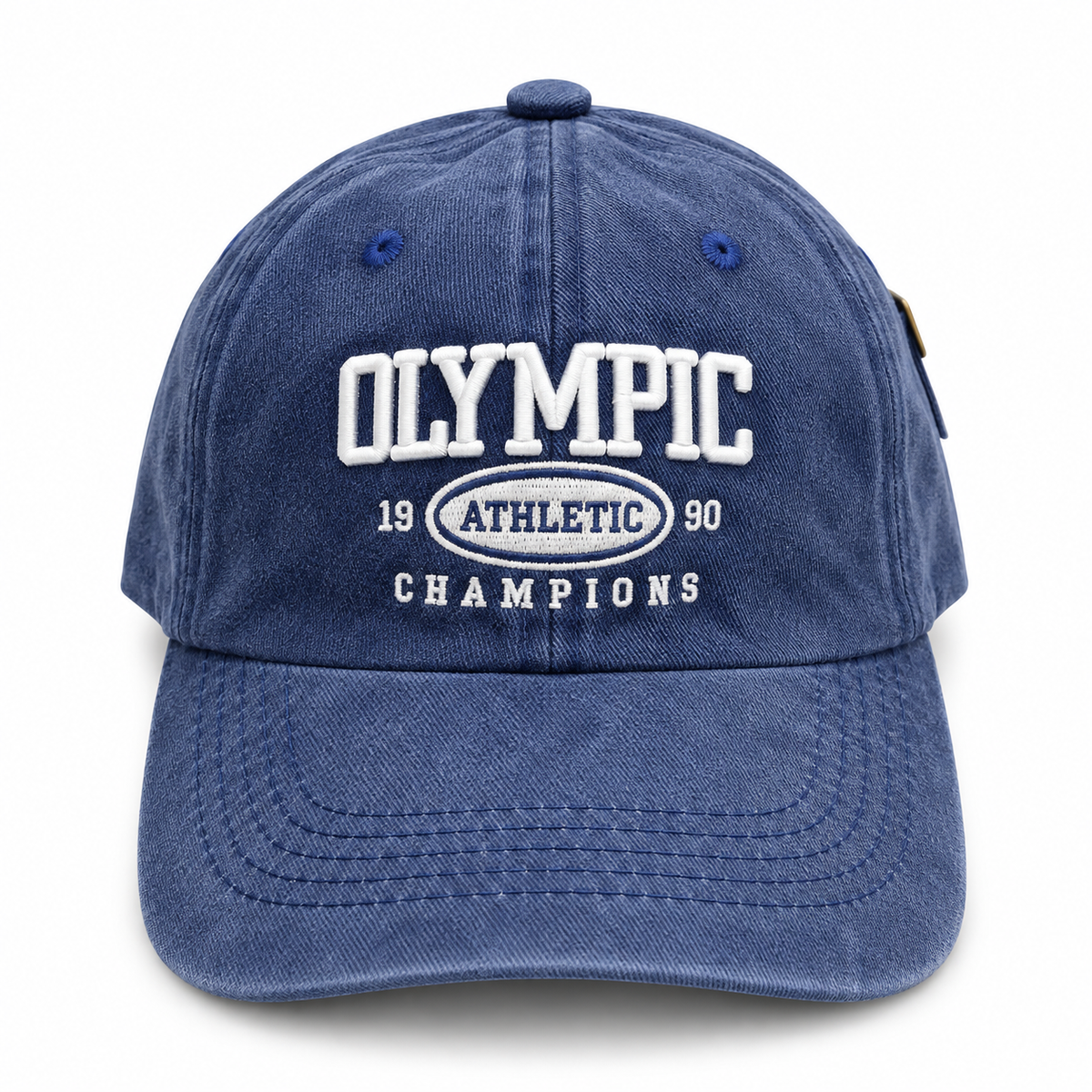 Front view of a vintage blue washed baseball cap with white embroidered Olympic Athletic graphic.