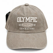 Front view of the grey washed baseball cap with embroidered Olympic Athletic logo.