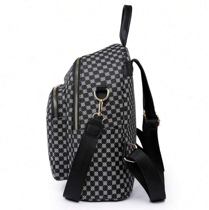 Black and white checkered backpack with a keychain on a white background