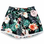 Women's black tropical floral lounge shorts with orange and white hibiscus flowers, green leaves and white lace trim – front view