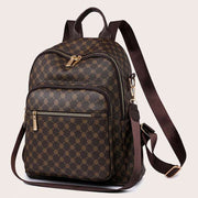 Womens brown casual backpack featuring an all over geometric pattern, gold tone zippers, and adjustable shoulder straps