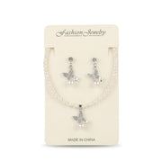 Women's faux pearl strand necklace and matching drop earrings featuring rhinestone butterfly pendants displayed on packaging.