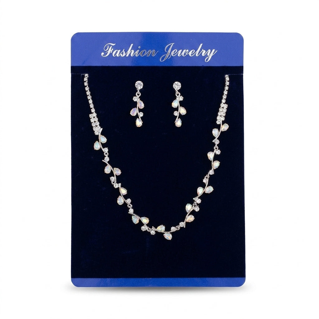 Women's silver-tone floral leaf vine necklace and matching teardrop crystal drop earrings set on velvet card