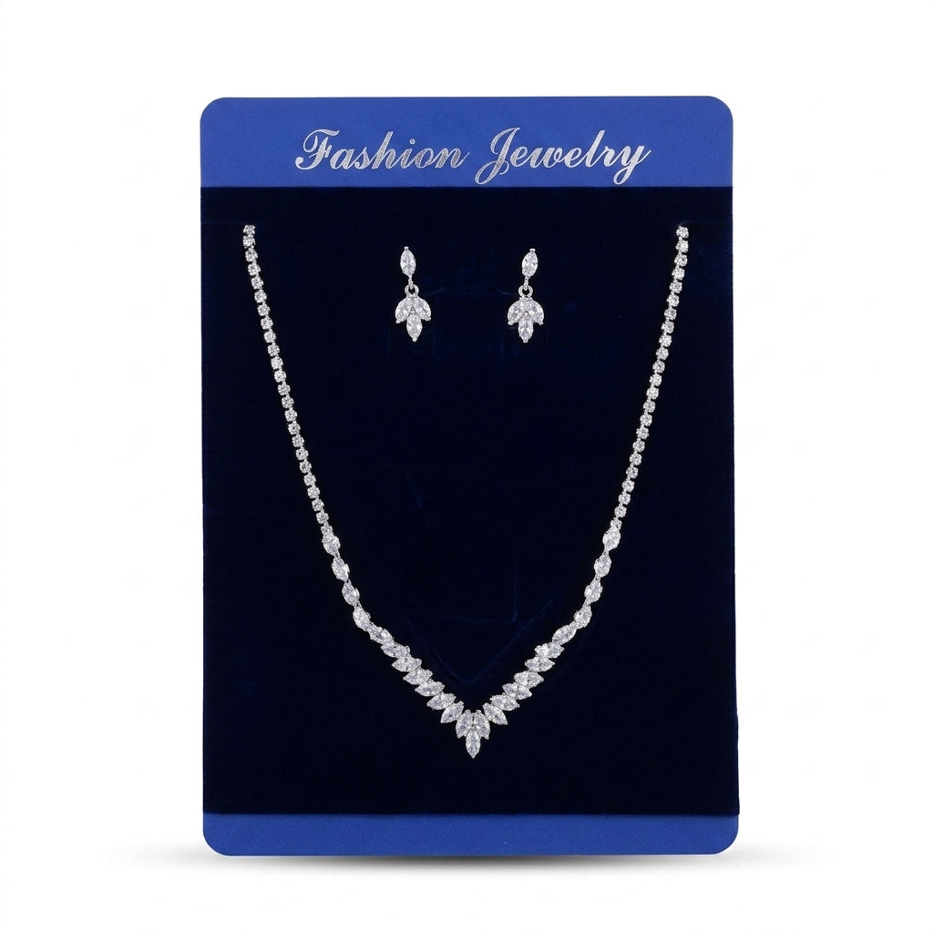 Women's silver-tone V-shape marquise crystal necklace and matching drop earrings set on blue display card