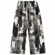 Women’s black grey and white abstract print wide-leg pants front view