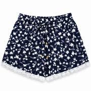Women's navy blue ditsy floral lounge shorts with white lace trim and elastic waistband – front view