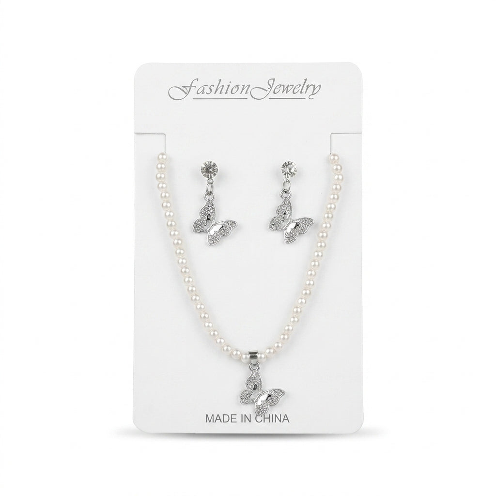 Women's faux pearl strand necklace and pavé crystal butterfly drop earrings set on card