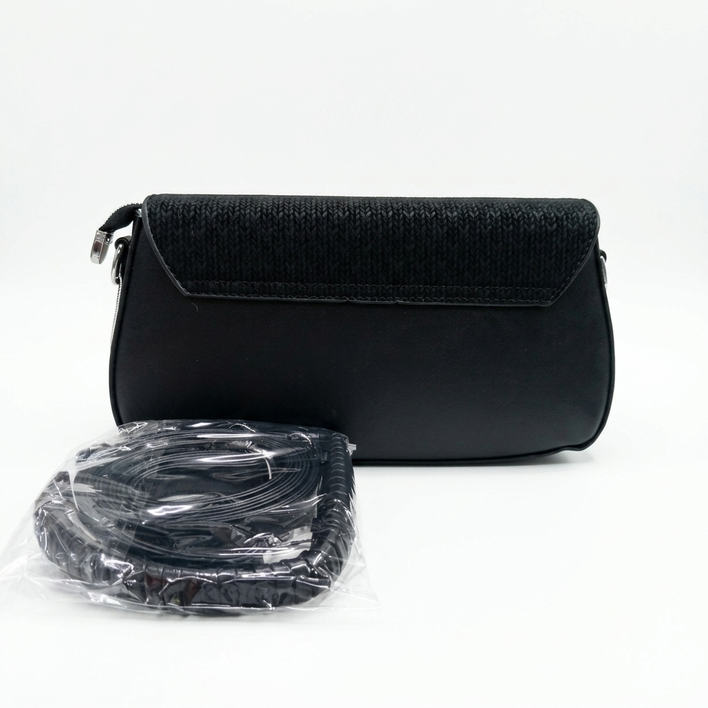 Back view of a structured black shoulder bag for women with a dark textured flap and packed strap
