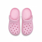 Women's light pink ventilated casual clogs with textured uppers, rounded toes and movable heel straps – top view
