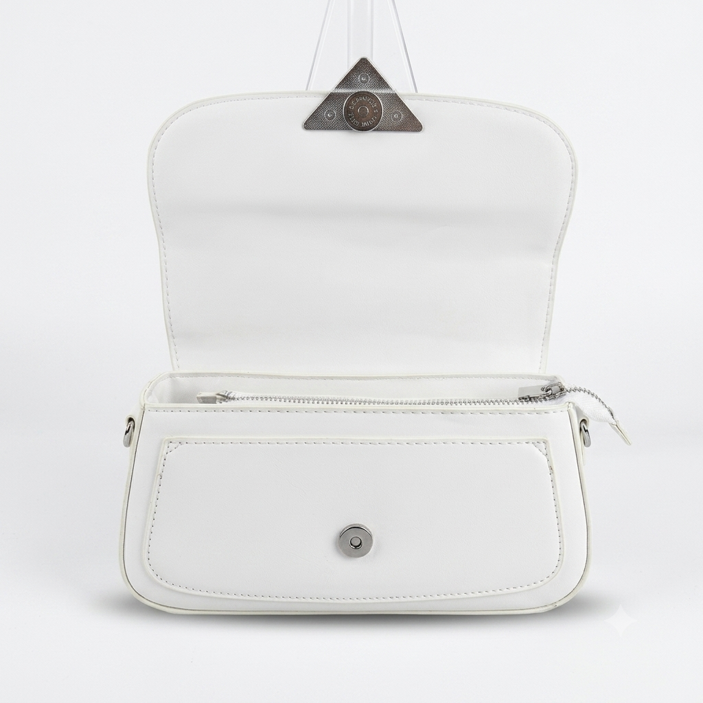 A white faux leather shoulder bag shown open, featuring a front zippered pocket with a silver snap button, silver side hardware, and a triangular metal logo plaque on the inside of the flap.