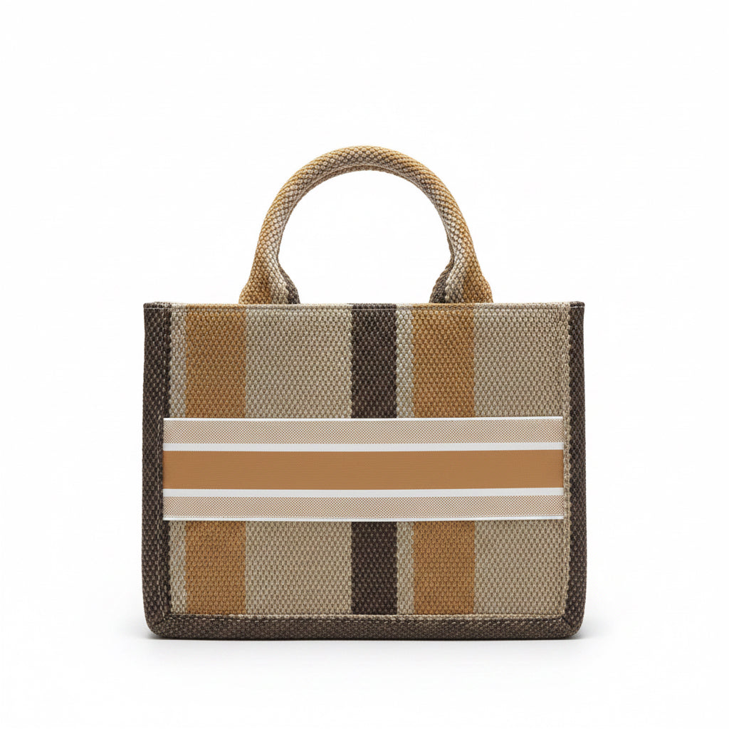 Striped handbag with a pattern of brown, beige, and white on a pink surface.