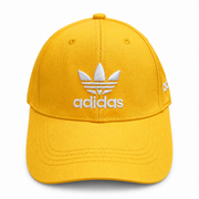Yellow baseball cap front view with white embroidered logo and curved brim